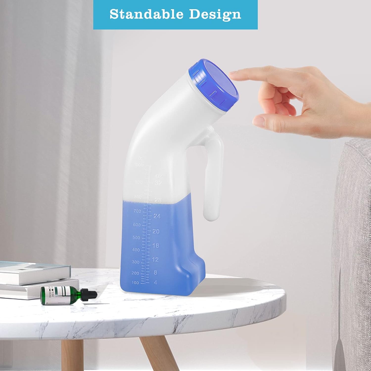 Hand holding a blue and white container on a marble surface with 'Standable Design' text.