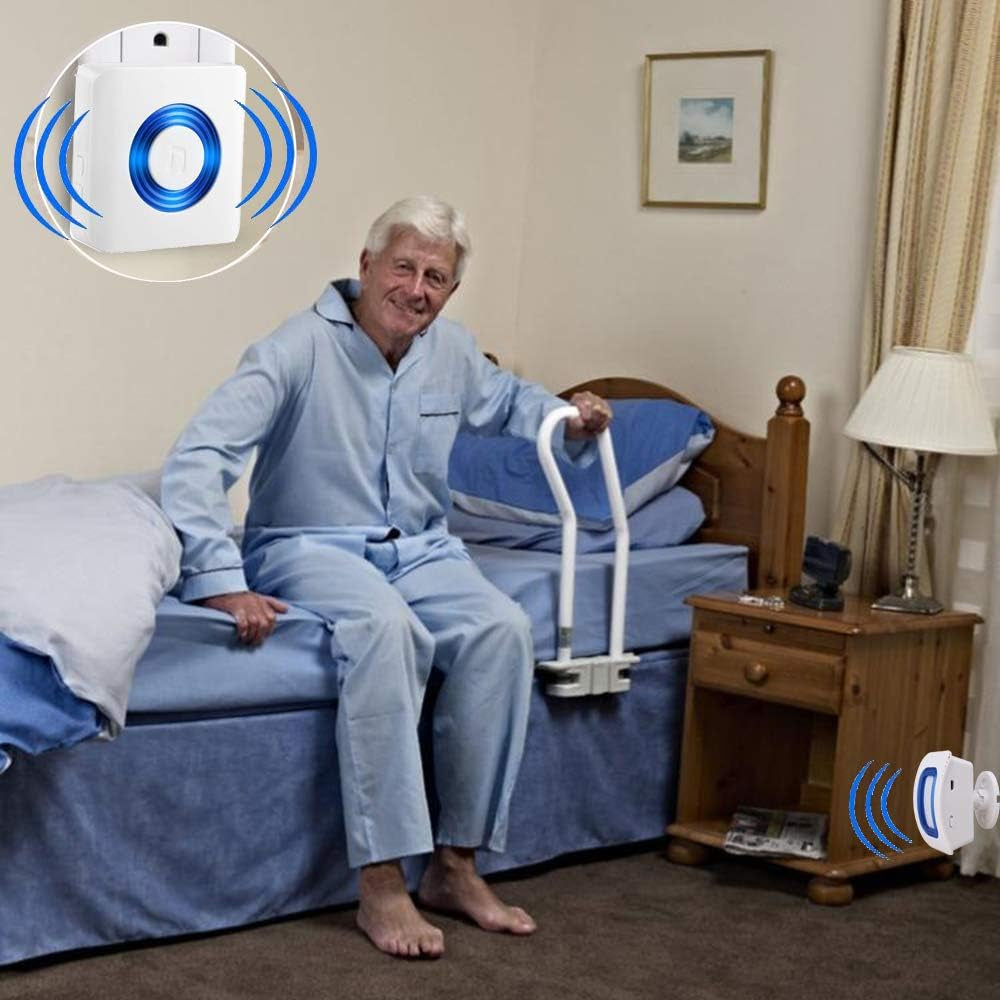 Man using a bed rail in a bedroom with a control device inset.