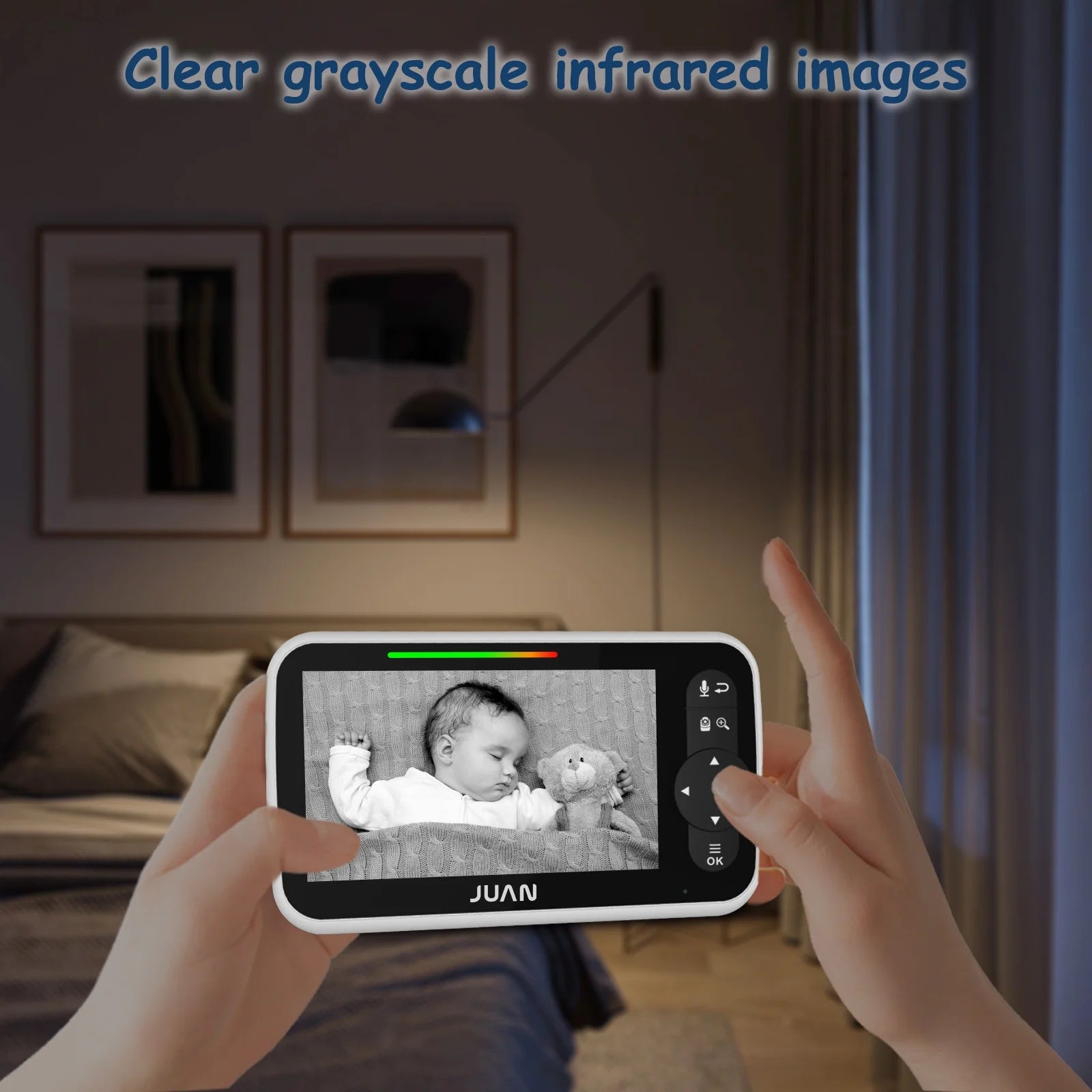 Person holding a device displaying an infrared image of a baby in a room.