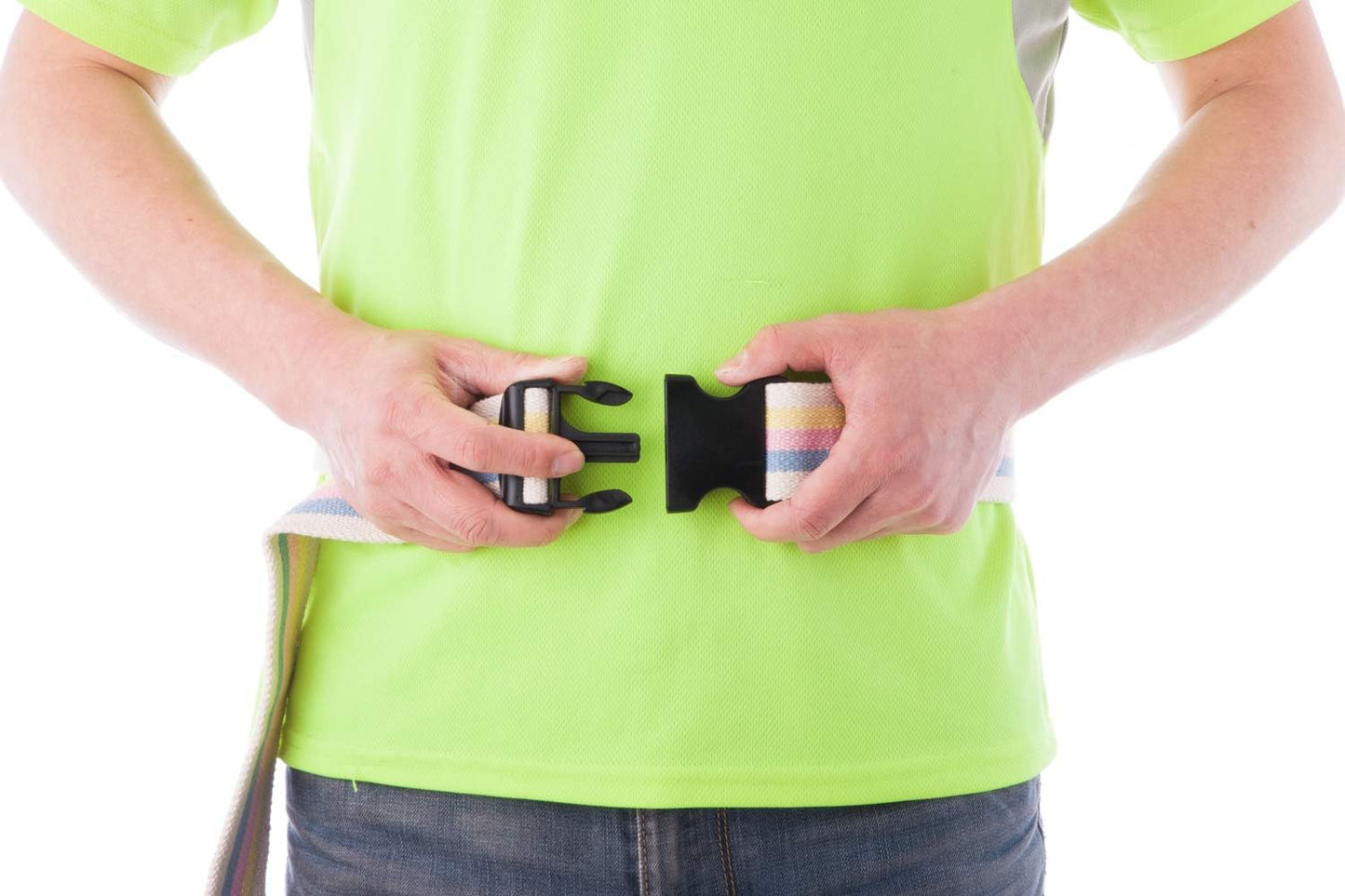 Person wearing a bright green shirt with a black belt buckle.