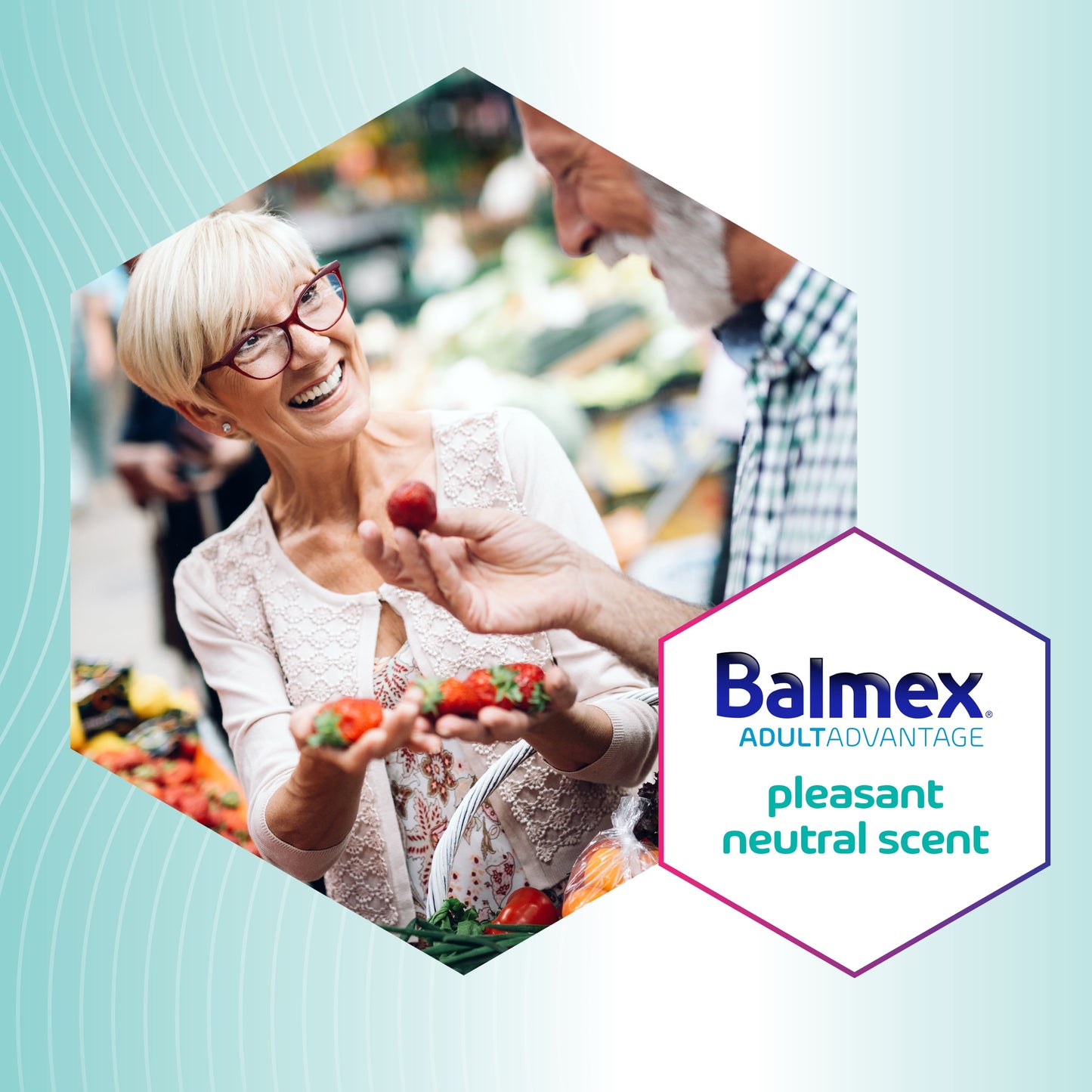 Woman holding strawberries with a person behind her, Balmex logo on a light blue background