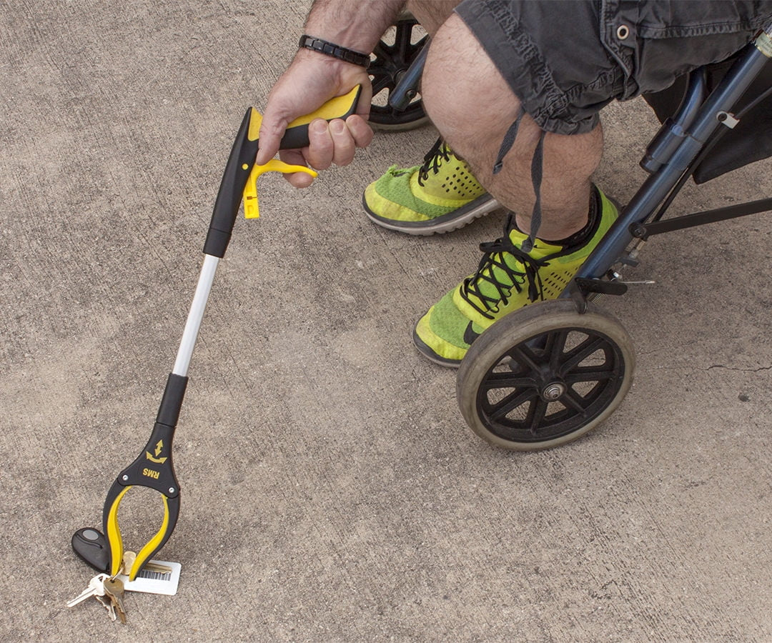 User retrieving items with Royal Medical grabber tool. Ideal for seniors and limited mobility.