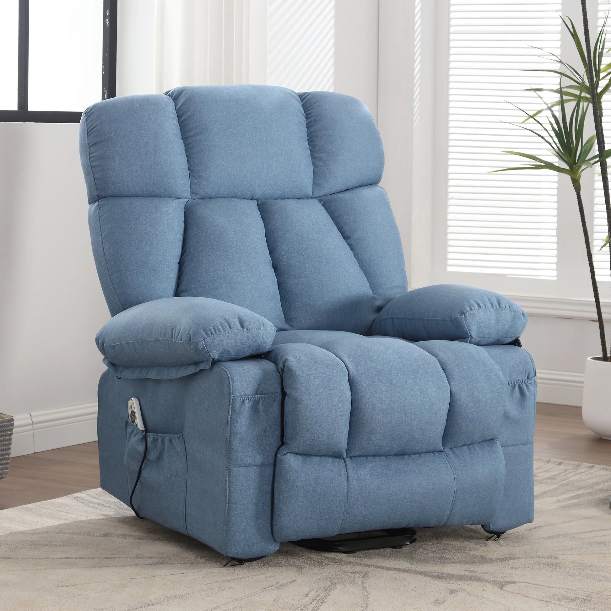Blue recliner chair in a room with a plant and window blinds.