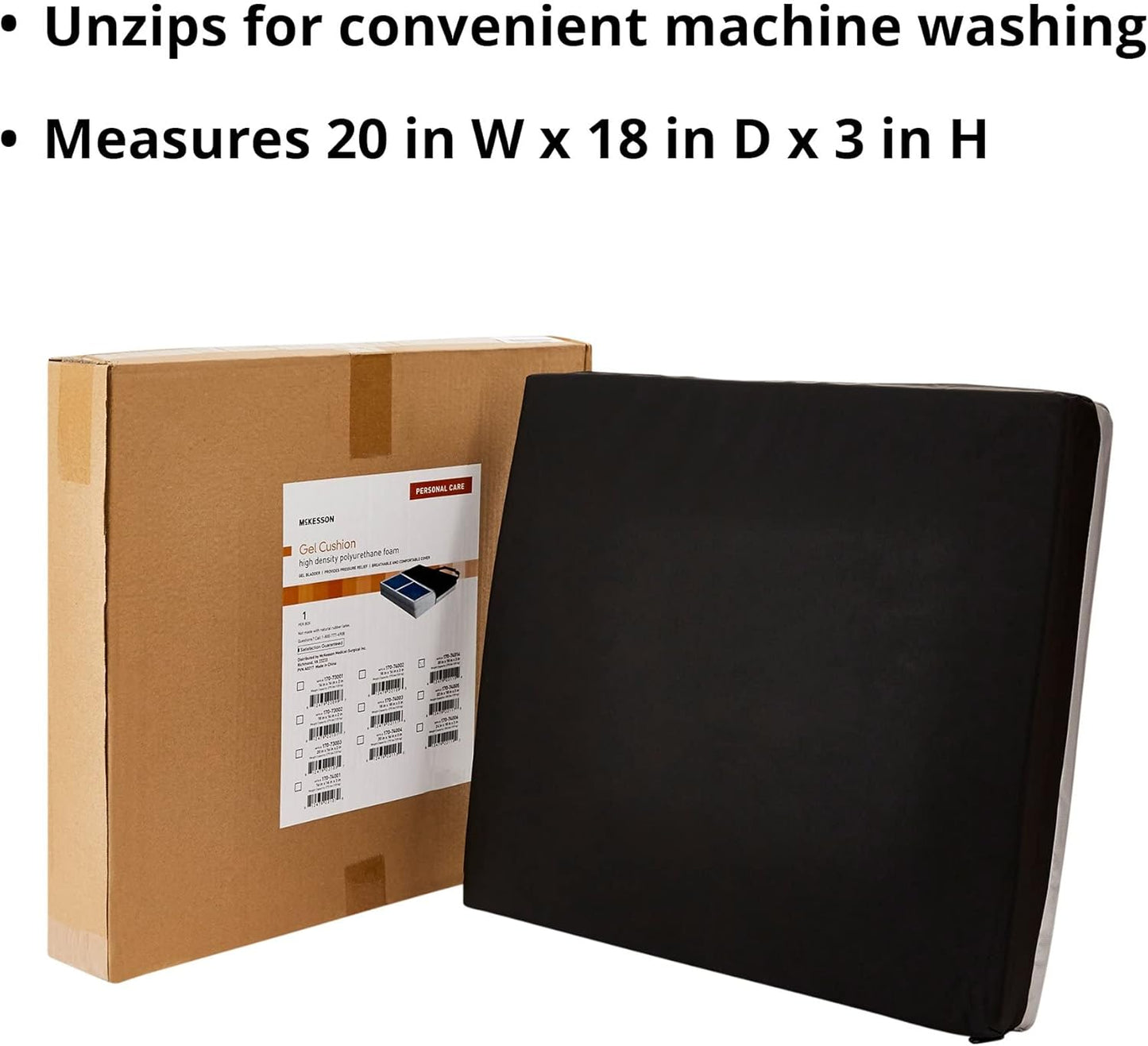 Black mat next to a cardboard box with a label, on a white background