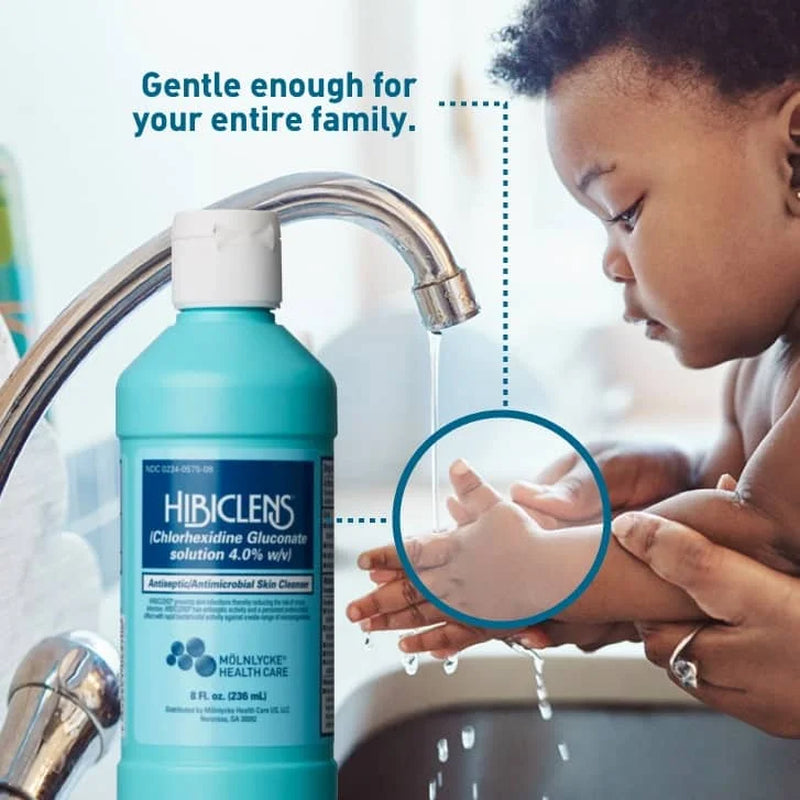 Hibiclens bottle with child washing hands under a faucet