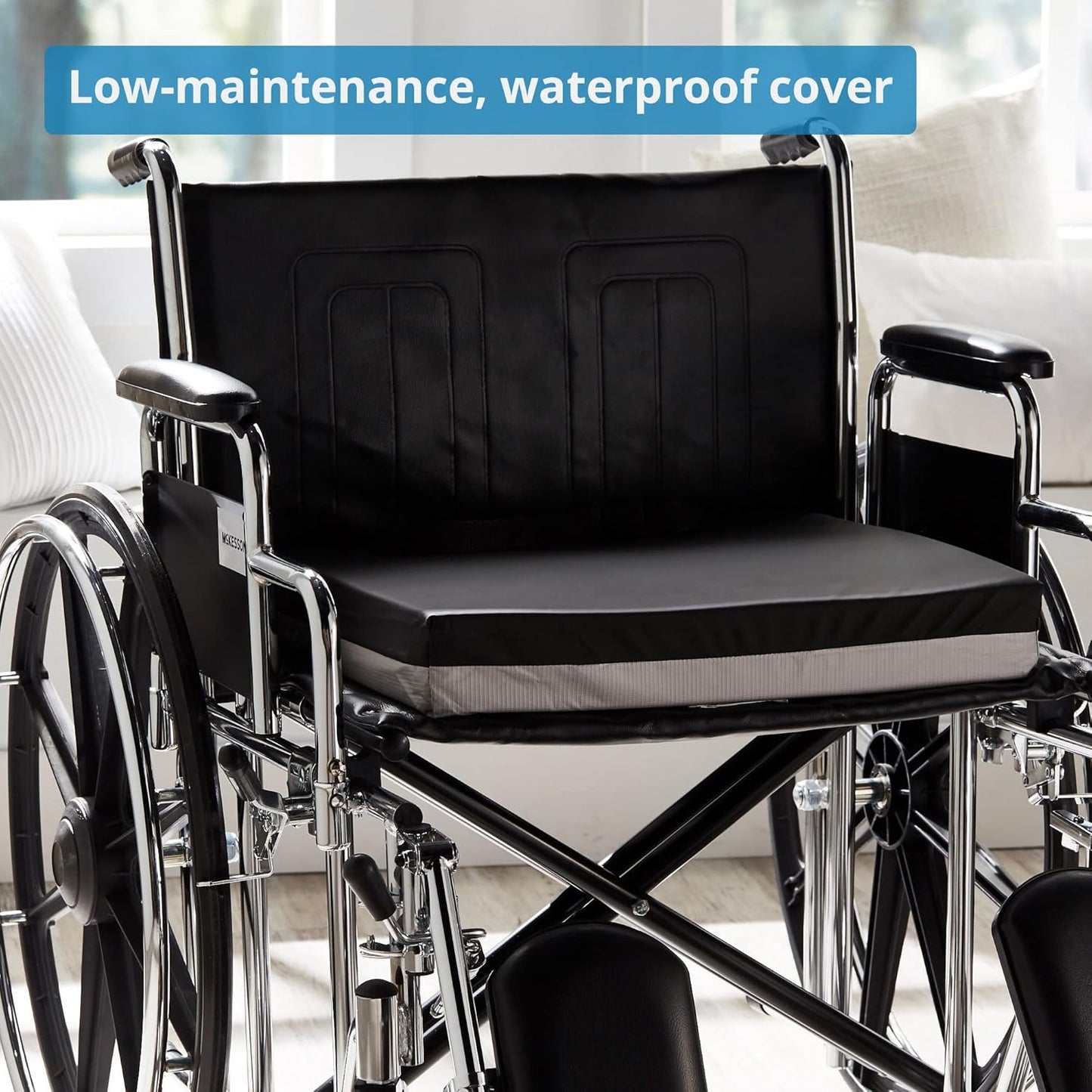 Wheelchair with a black cushion cover on a blurred indoor background