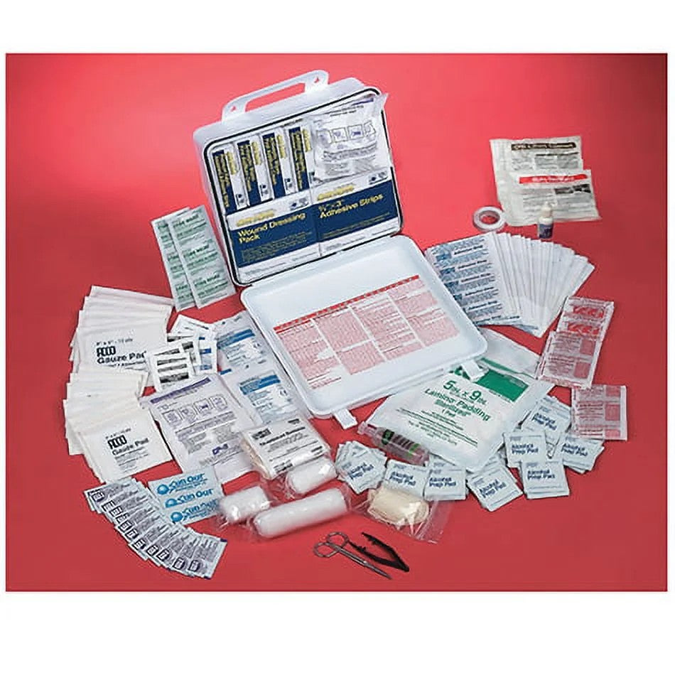First aid kit with various supplies on a red background