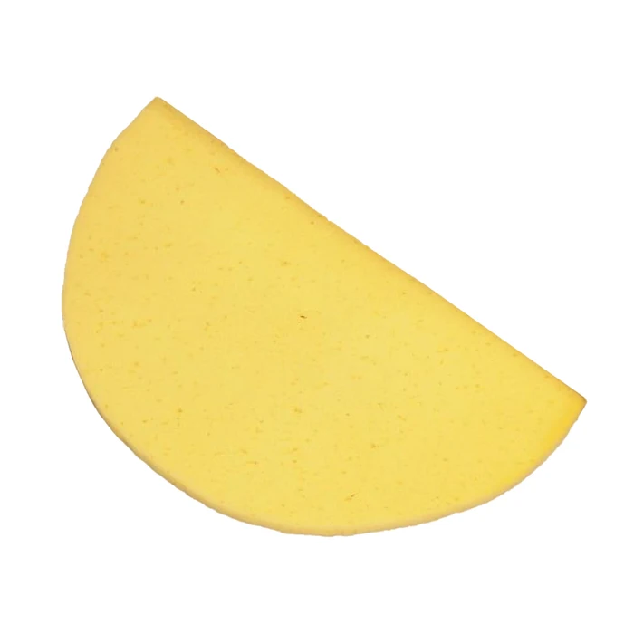 Yellow sponge bath mat on a white background