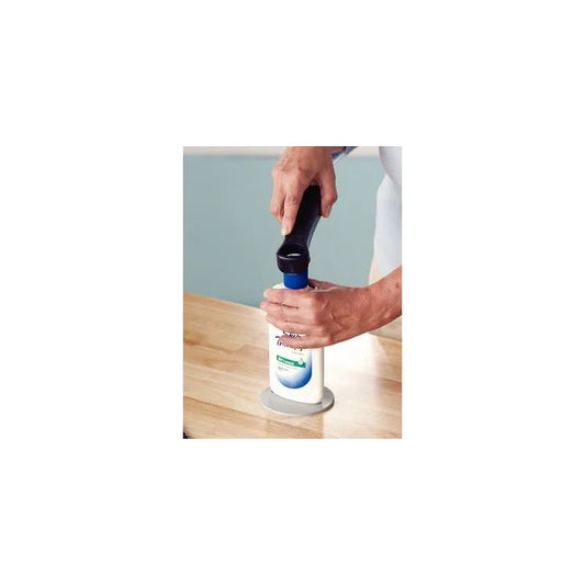 Person using a bottle opener on a wooden surface with a white background