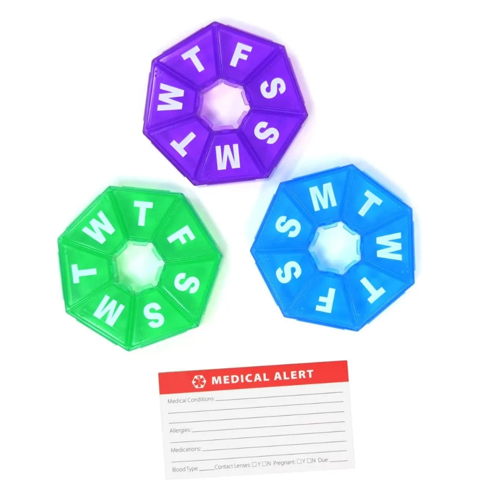 Three pill organizers in purple, green, and blue with a medical alert card on a white background.