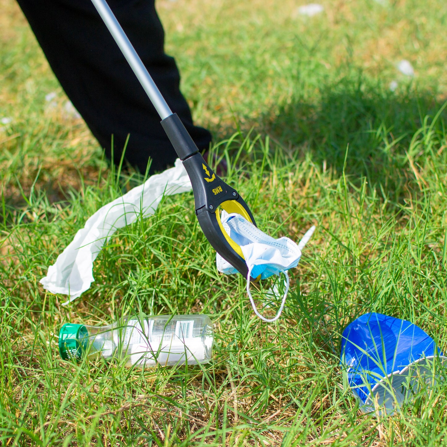 User retrieving items with Royal Medical grabber tool. Ideal for seniors and limited mobility.