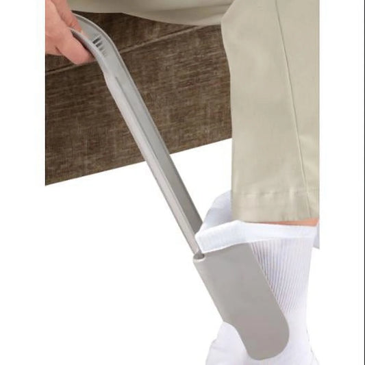 Person using Sock Horse Sock Aid to apply socks while seated. Ideal for seniors and users with limited mobility.
