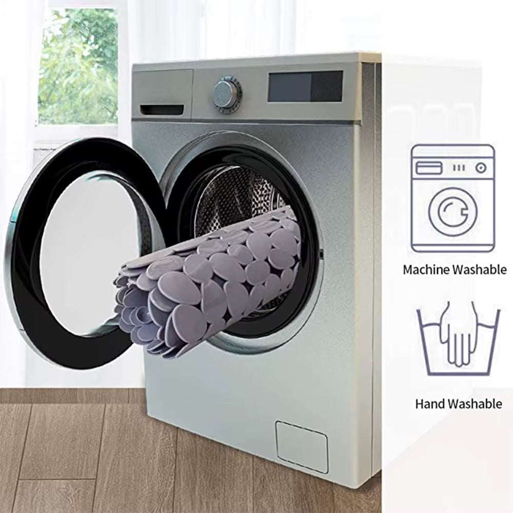 Product being loaded into a washing machine with icons indicating machine and hand washability.