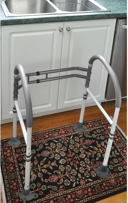 Top-down view of Vaunn toilet safety rails highlighting clamp mechanism and non-slip armrests for safe bathroom use.