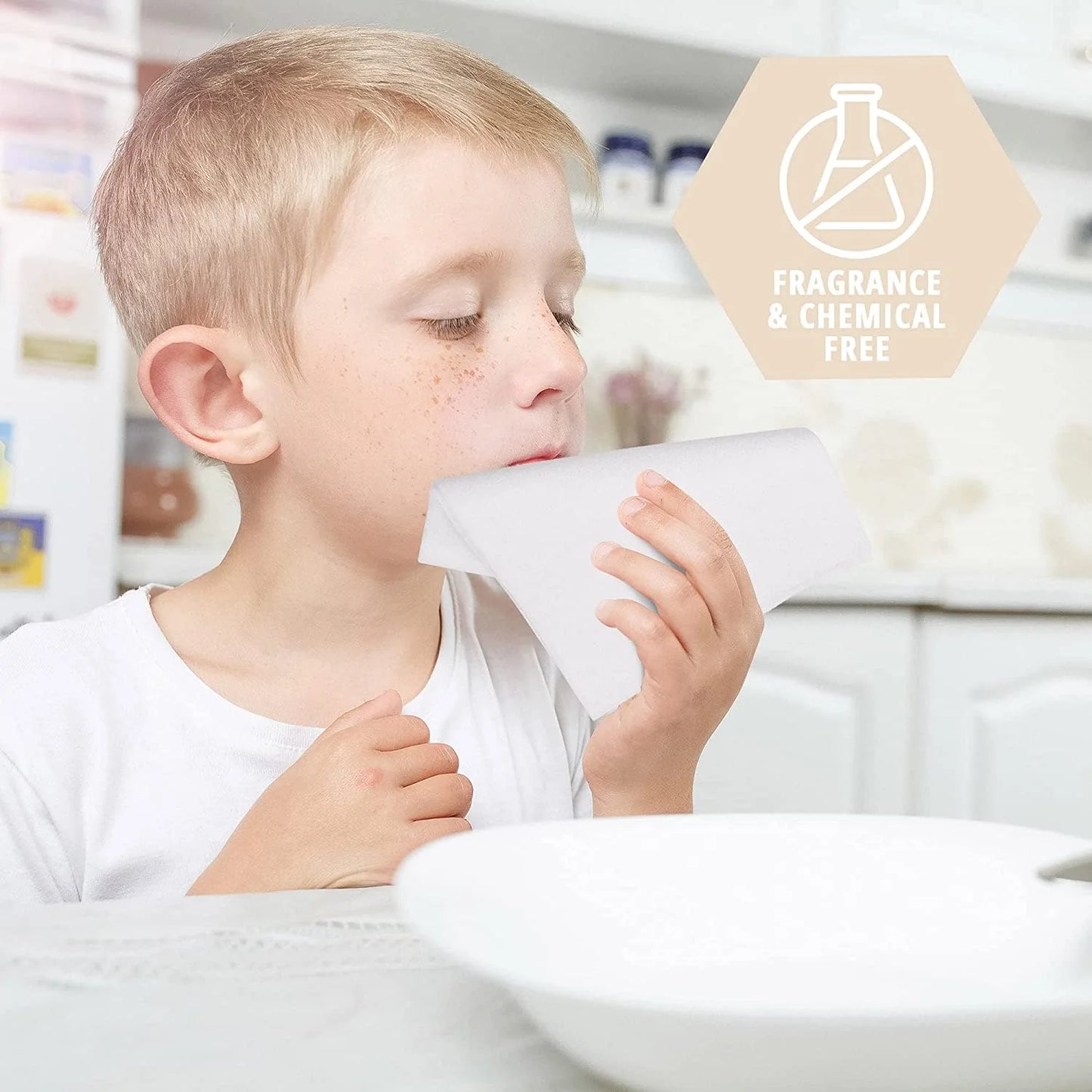 Child holding a product with a 'fragrance & chemical free' label in the background