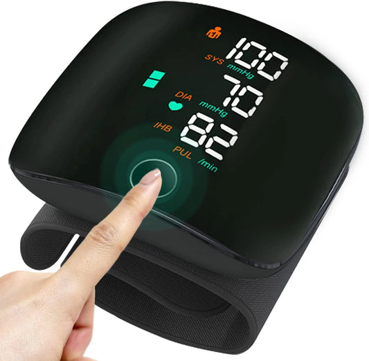 Digital blood pressure monitor with a hand pointing at the screen on a white background

