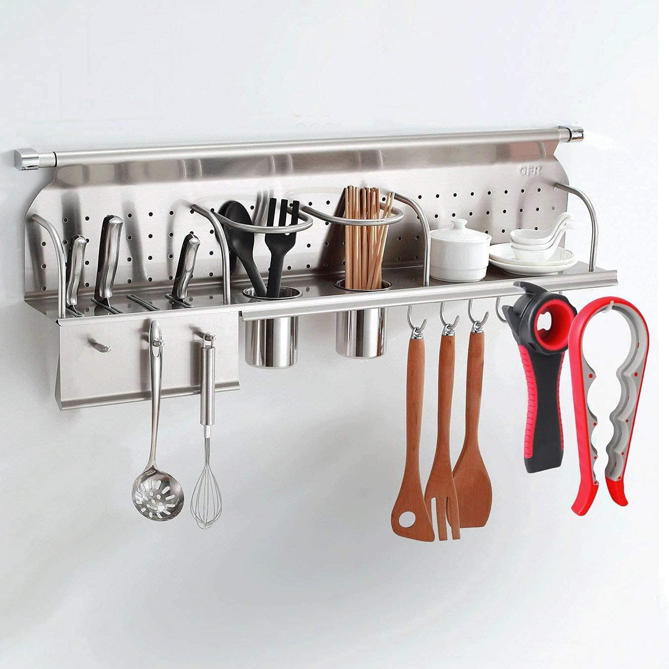 Stainless steel wall-mounted kitchen organizer with utensils and tools on a white background