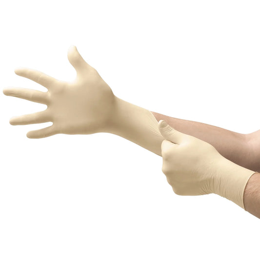 Beige latex gloves being worn on a white background