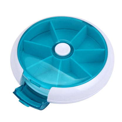 Teal and white round container with compartments on a white background

