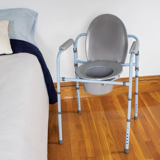 Carex 3-in-1 Bedside Commode with removable bucket. Functions as a portable toilet, raised seat, or safety frame for home mobility support.