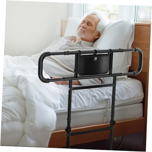 Bed rail being used by an elderly person in bed

