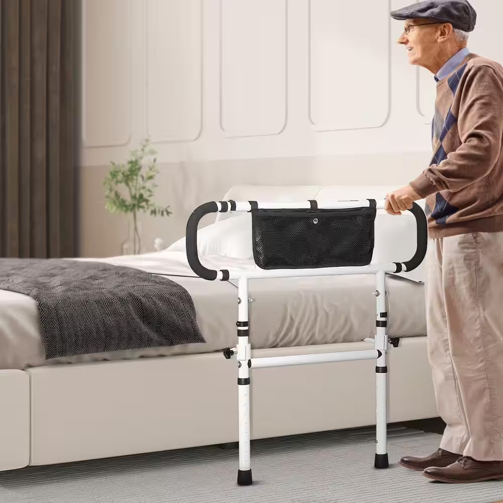 Man using a bed safety rail in a bedroom setting

