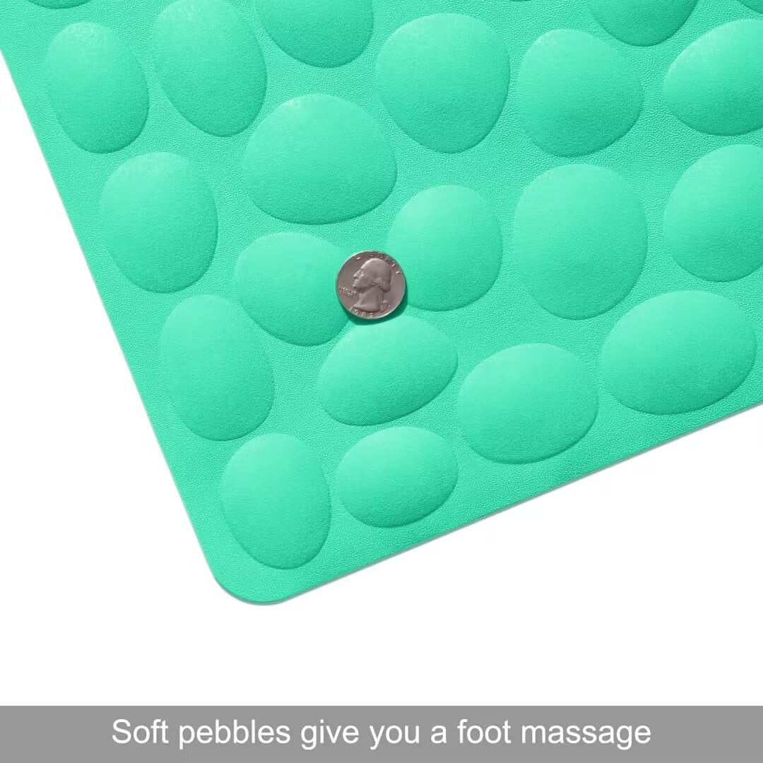 Green foot massage mat with raised pebble-like凸起, showing a coin for scale.