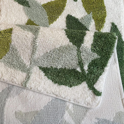 Textured green and white fabric with leaf patterns

