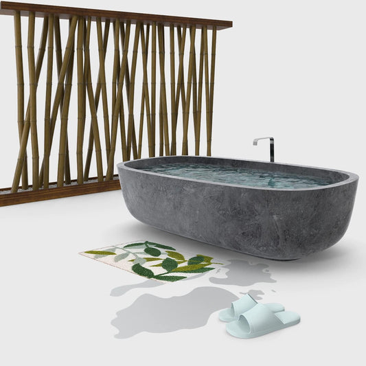 Gray freestanding bathtub in a modern bathroom with a wooden screen and greenery.

