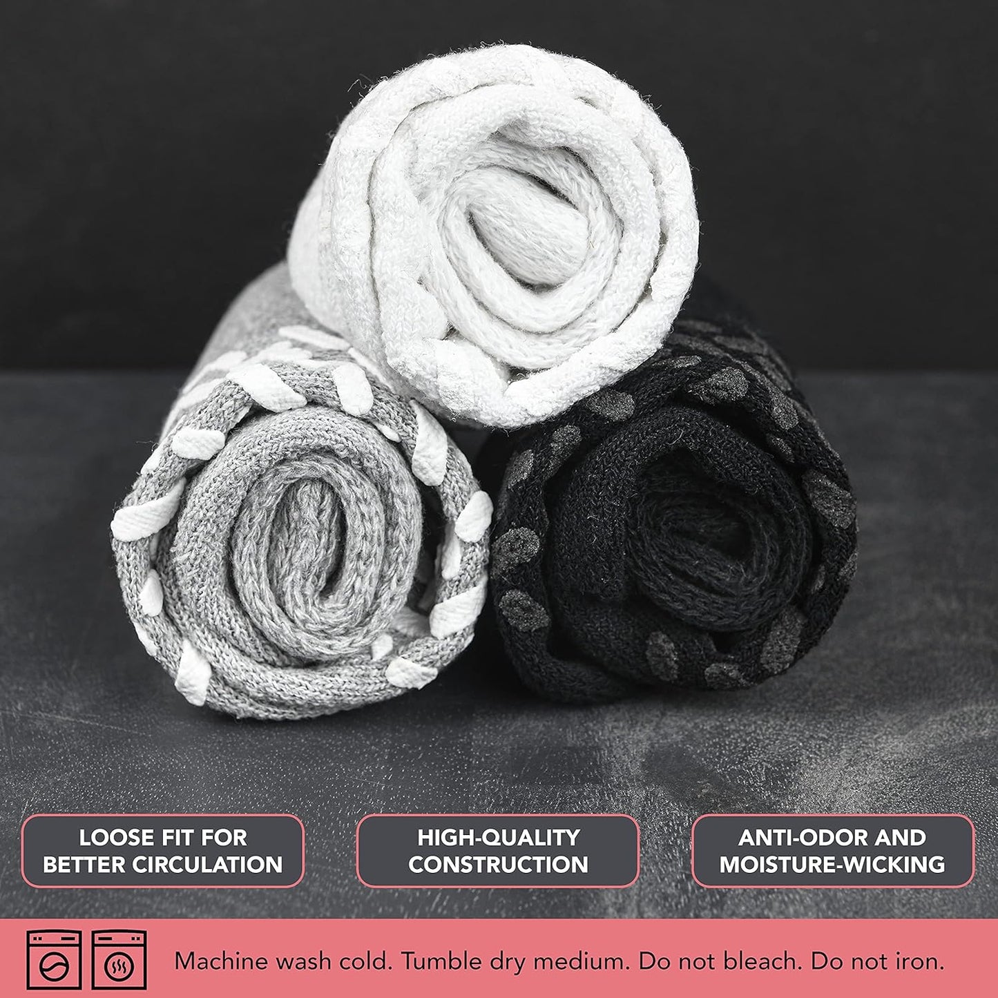 Three rolled-up socks on a dark surface with text about sock features.