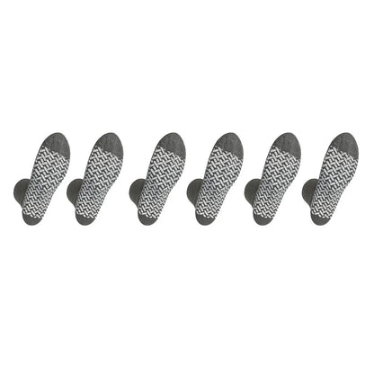 Set of seven black and white patterned socks arranged in a row on a white background