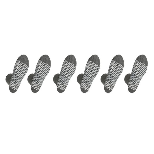 Set of seven black and white patterned socks arranged in a row on a white background