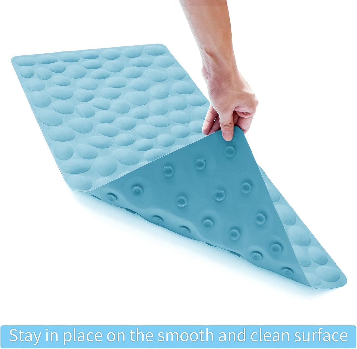 Blue wedge-shaped mat with textured surface held by a hand on a white background