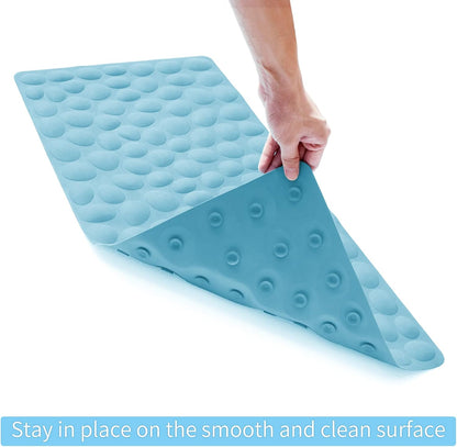 Blue wedge-shaped mat with textured surface held by a hand on a white background
