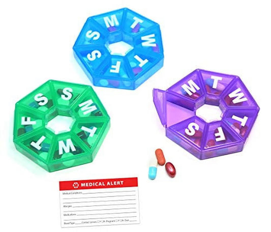 Three colorful pill organizers with a medical alert card on a white background

