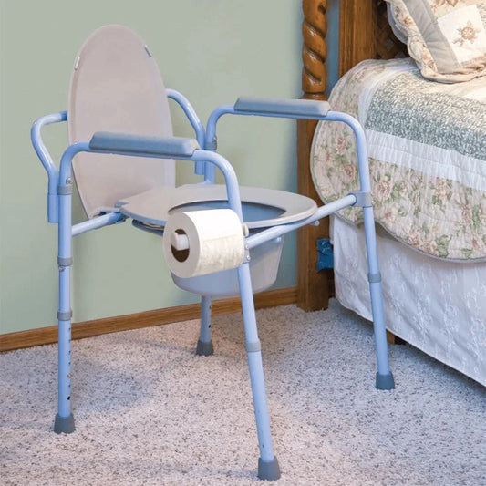 Carex 3-in-1 Commode positioned beside a bed or toilet. Ideal for seniors, recovery, and accessible bathroom use.