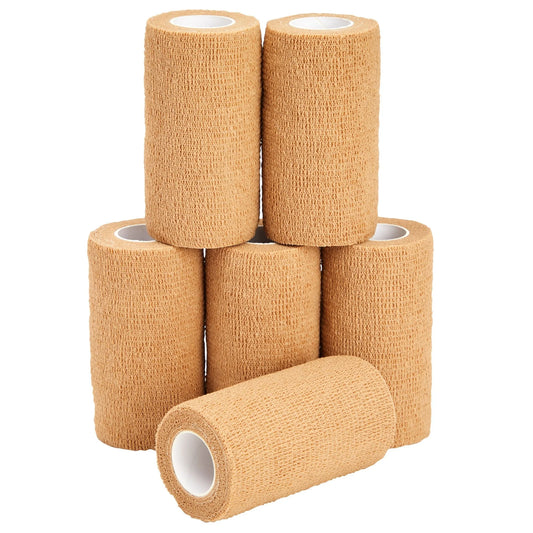 Six rolls of beige elastic bandage on a white background

