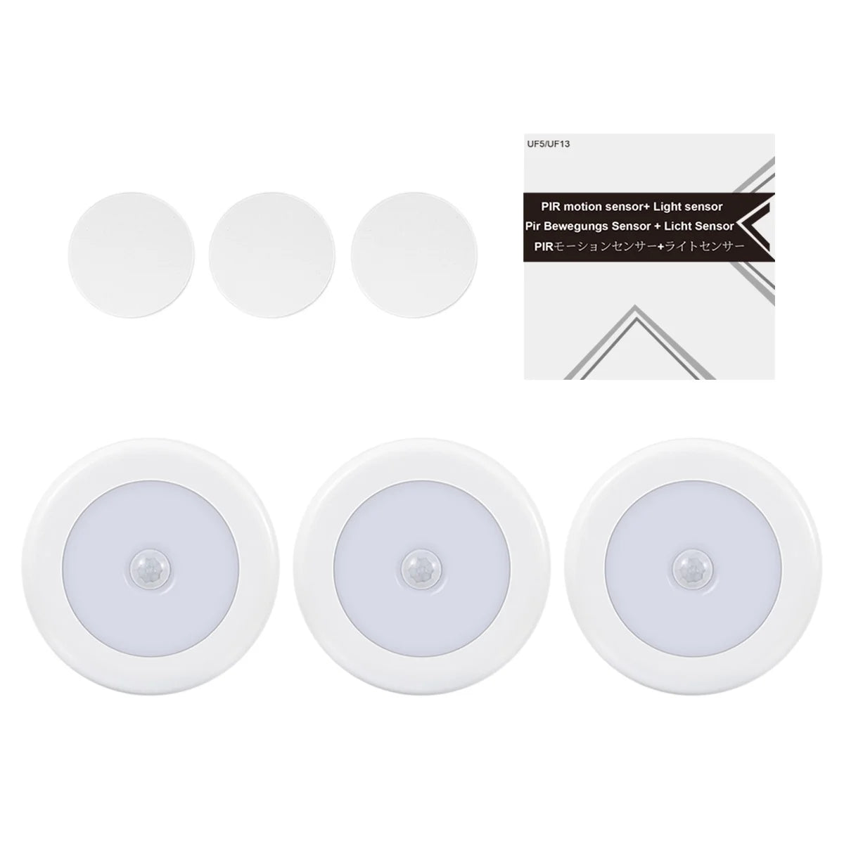 Three round light sensors with a packaging box on a white background

