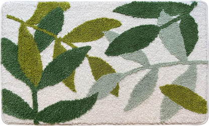 Decorative rug with green leaf pattern on a light background

