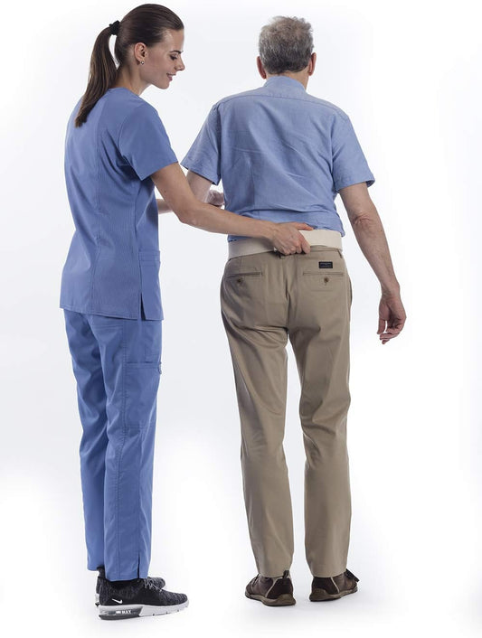 Two people wearing blue scrubs and beige pants on a white background