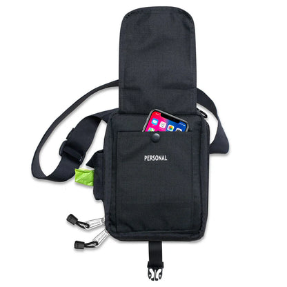 Black crossbody bag with a pocket holding a smartphone and other items on a white background

