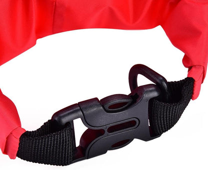 Close-up of a black clasp with a red dry bag background

