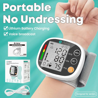 Wrist blood pressure monitor with packaging and charging cable on a teal background

