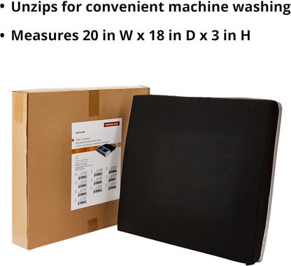 Black mat next to a cardboard box with a label, on a white background

