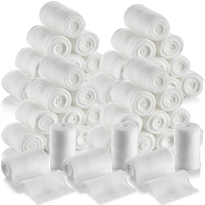 Multiple rolls of white bandage on a white background