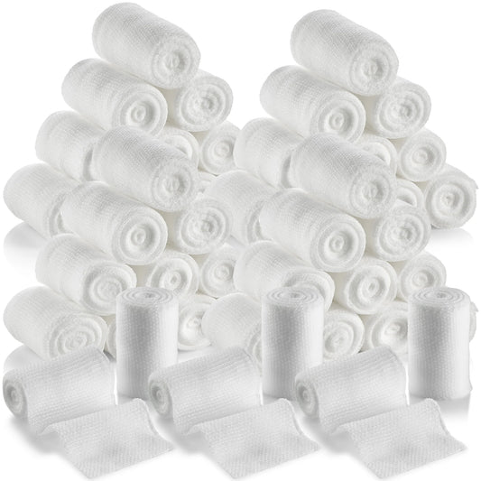 Multiple rolls of white bandage on a white background
