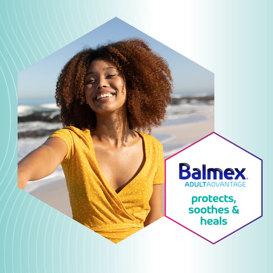 Woman taking a selfie on a beach with Balmex logo overlay

