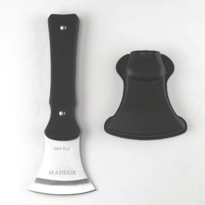 Black knife with a white blade on a white background, featuring the brand 'Maddox'.
