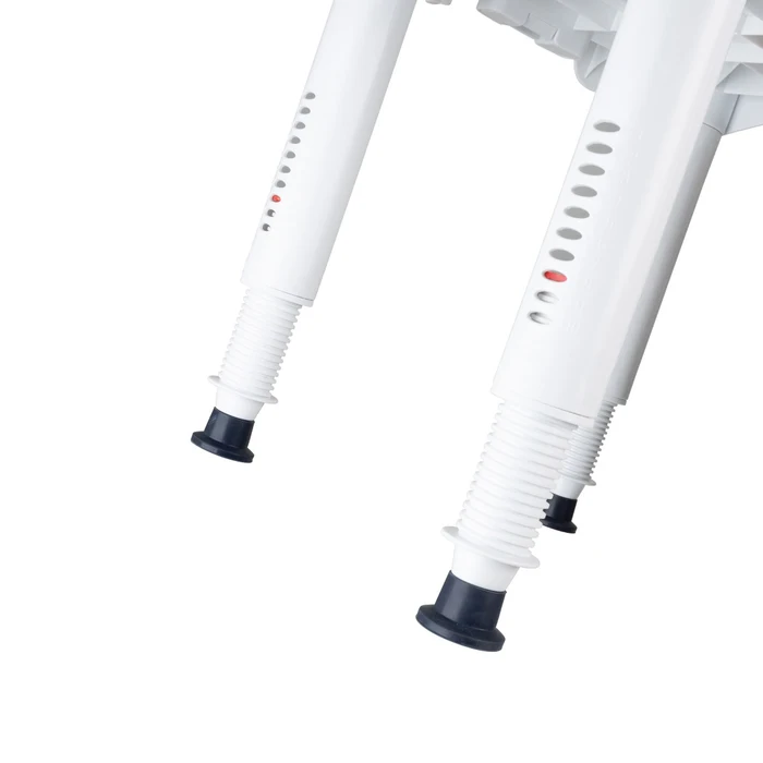 Close-up of white legs with black feet on a white background