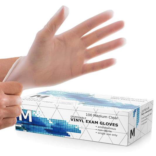 Box of disposable vinyl exam gloves with a hand wearing a glove on a white background